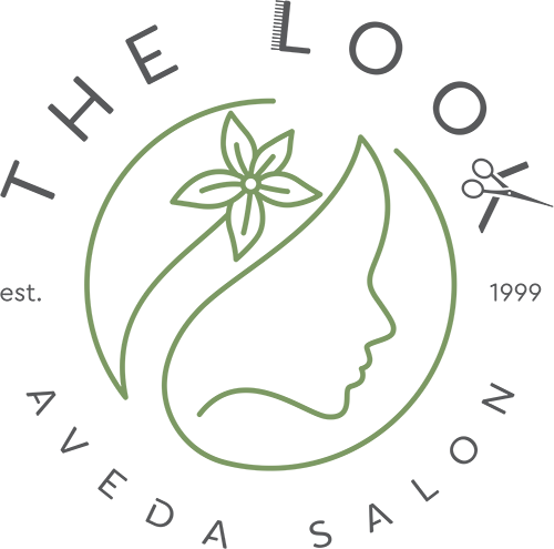 - The Look in Gladstone, NJ Logo for "The Look Aveda Salon" featuring stylized green profiles of a woman’s face inside a circular design, with the salon name written around the circle. - The Look in Gladstone, NJ